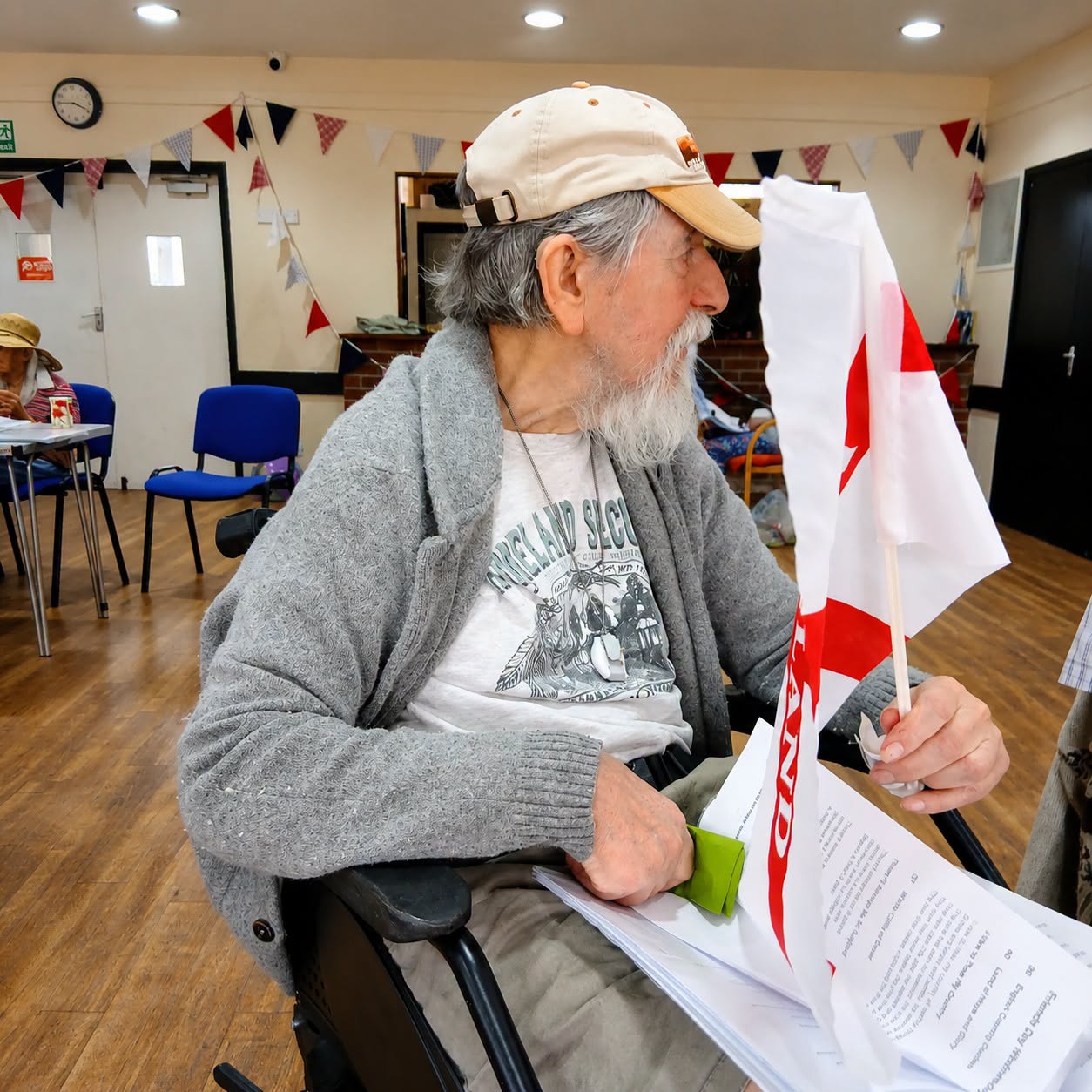 Barry holding an England flag during the community event