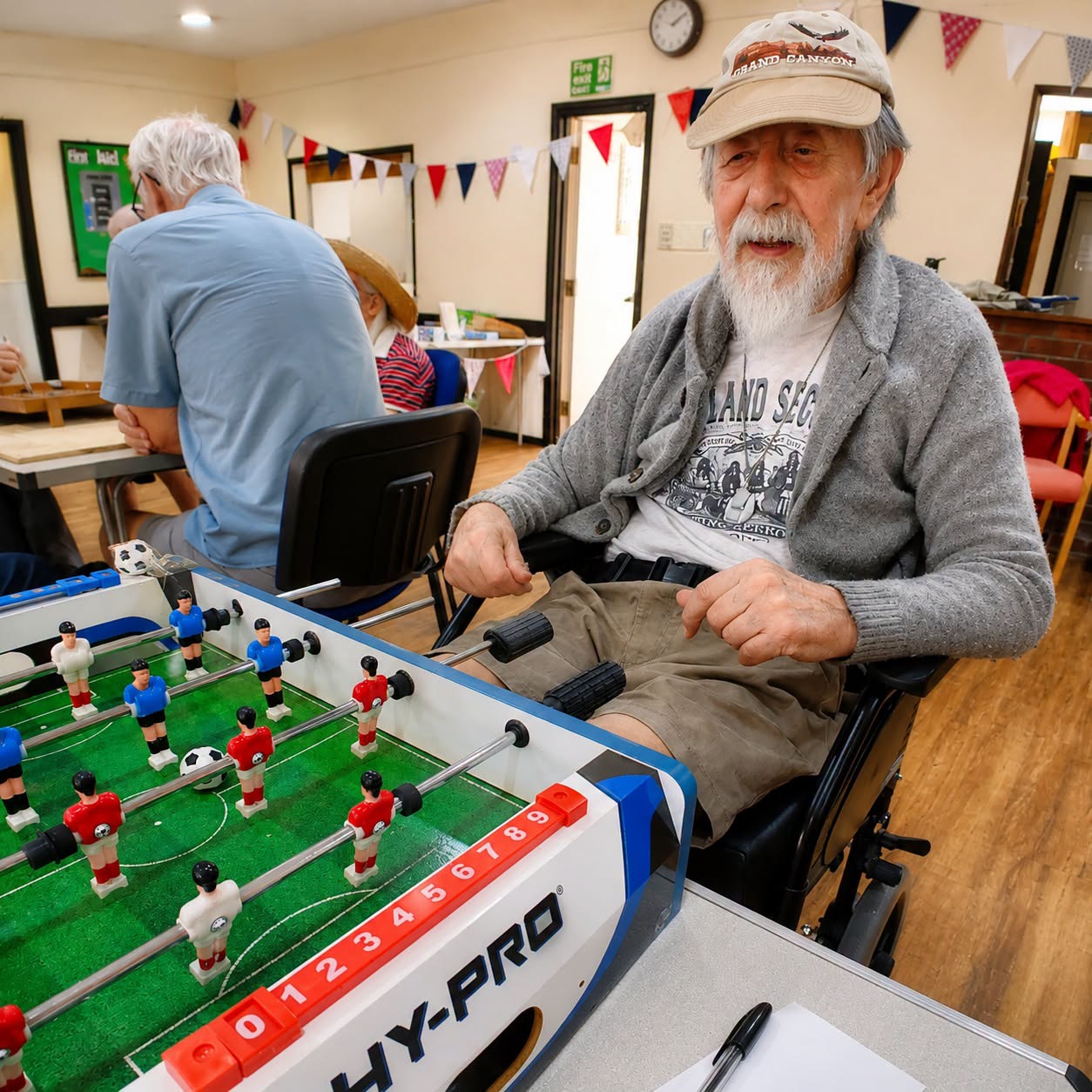 Barry playing table football at the community event