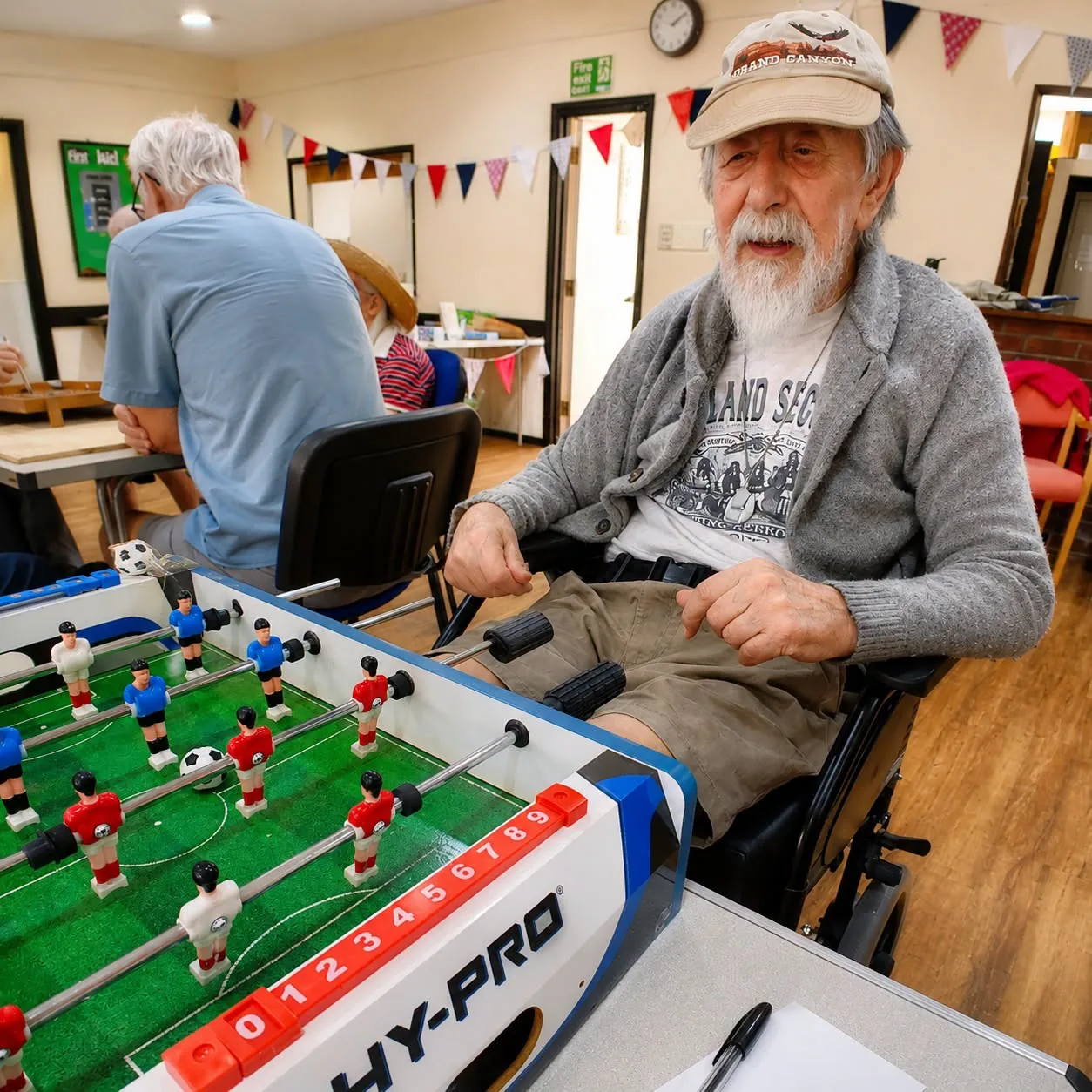 Barry playing table football at the community event