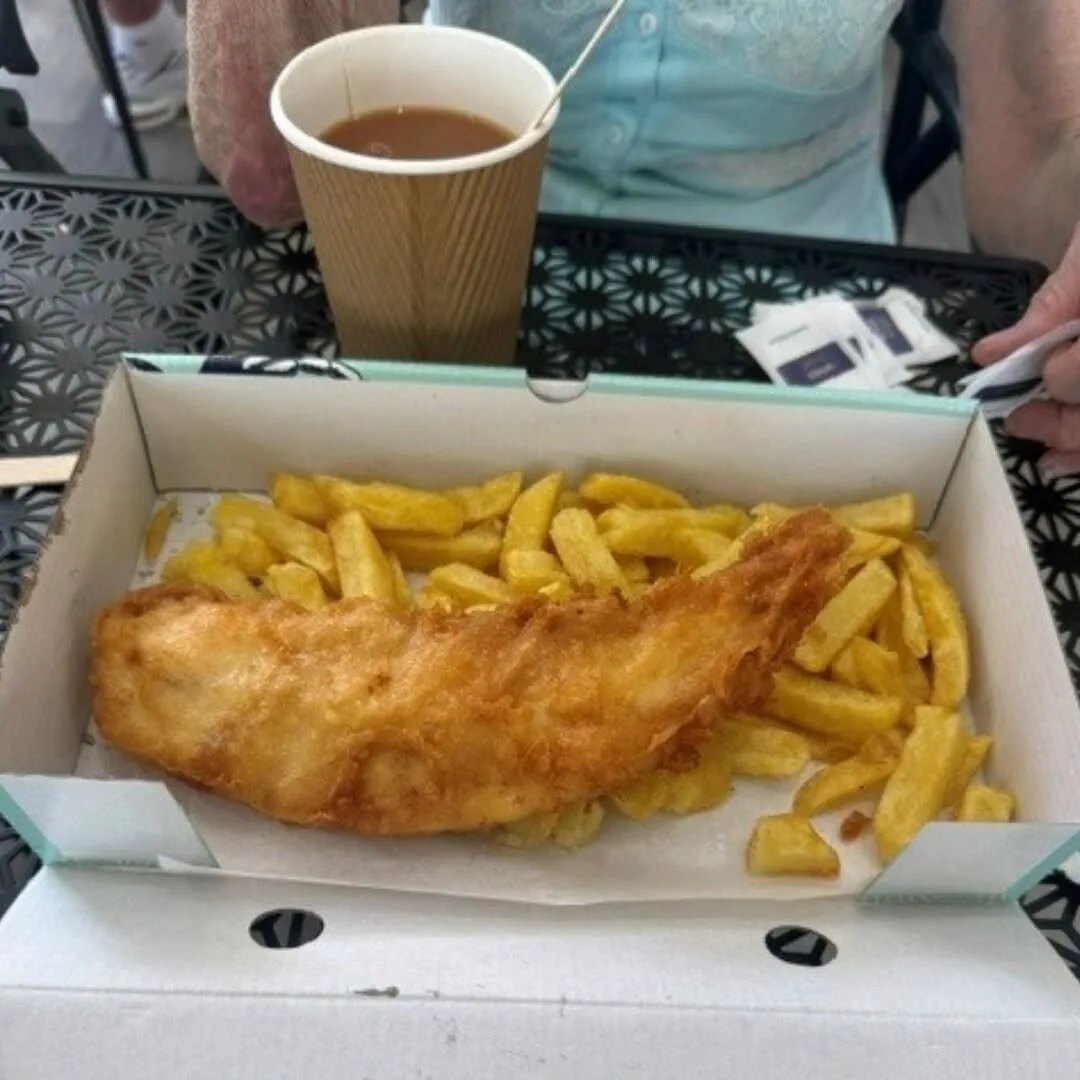 Fish and chips with a hot drink during Hazel’s supported day trip to Looe