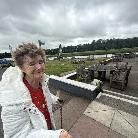 Pam outside the Passage House Inn with the River Teign in the background