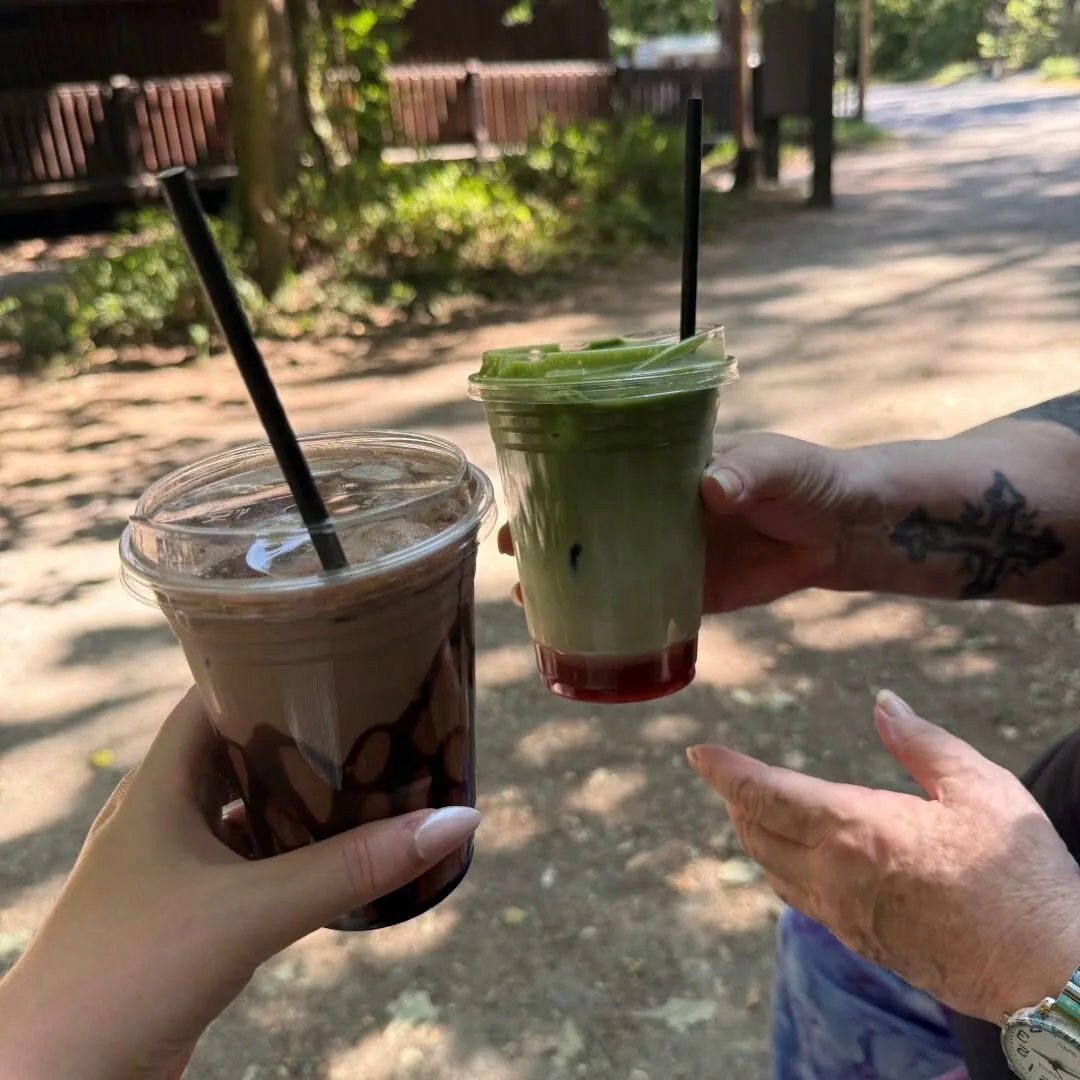 Tina and Jade holding cold drinks during an afternoon at Stover Country Park